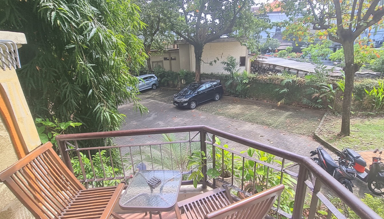 Private Balcony View overlooking Garden and Pool at Barbs Bali Apartments Legian
